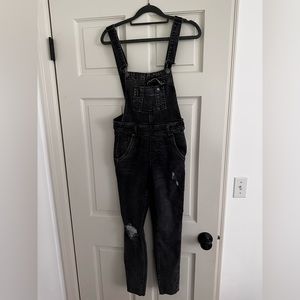Free people never worn denim overalls. Color black. Size 24. Brand new with tags